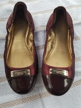 COACH Darci Women’s Burgundy Ballet Flats with Cap Toe and Gold Plaque